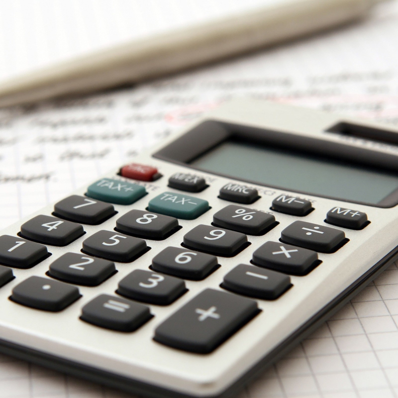 A calculator sits on top of a piece of paper at an accounting firm in Ottawa.