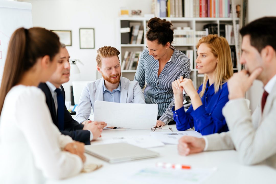 A group of Tax Accountants sitting around a table.